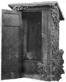 An early 20th century outhouse with a fanciful design.